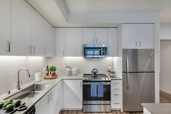 Quartz countertops & subway tile backsplashes